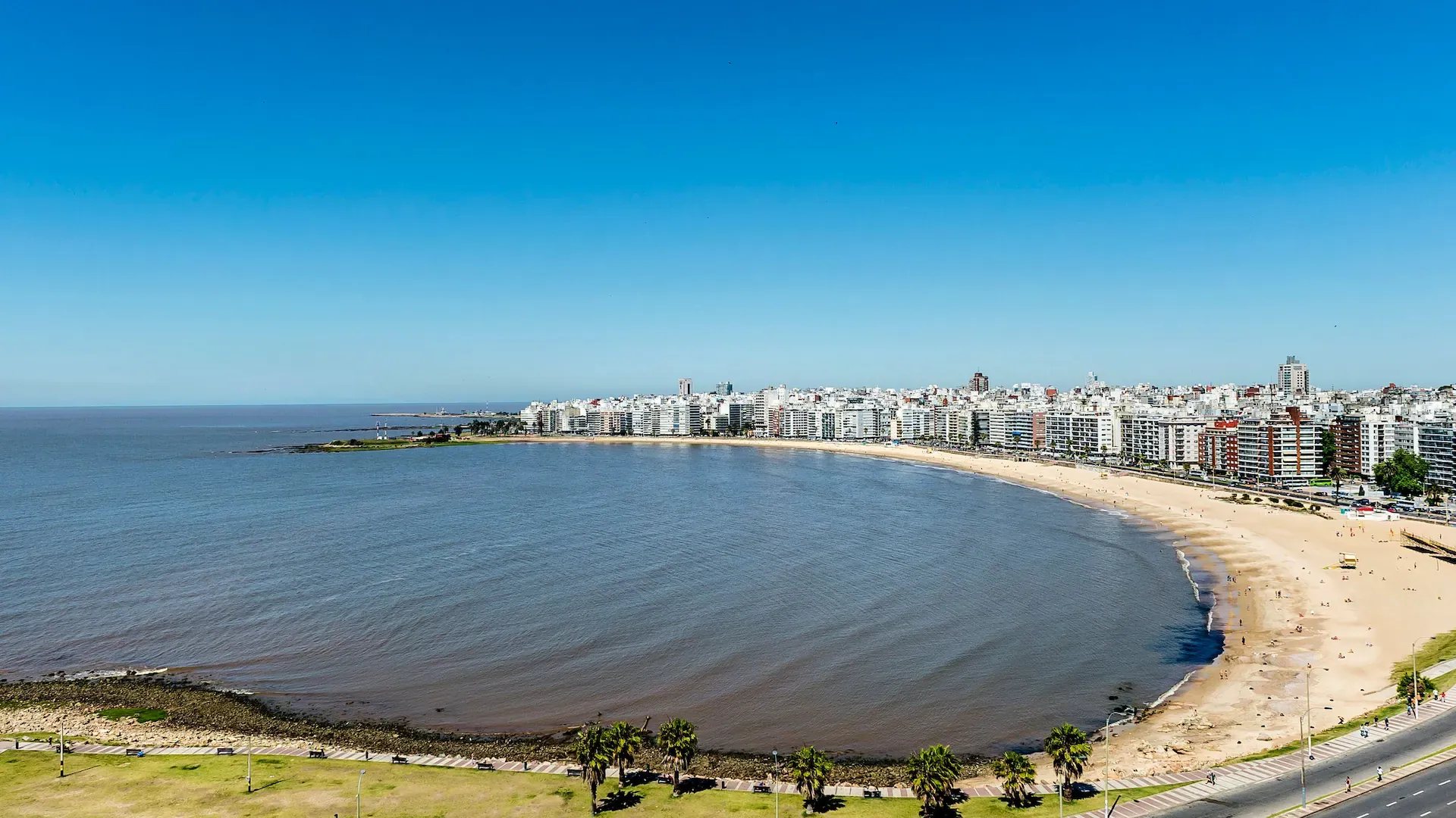 a body of water with buildings in the background