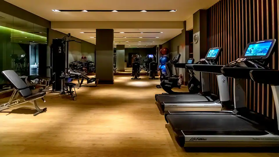 a room with treadmills and exercise equipment