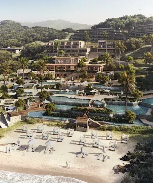 a resort with a pool and a beach