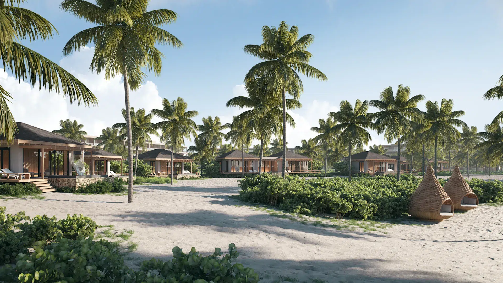 a group of houses with palm trees and bushes