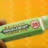 a hand holding a green wrapper