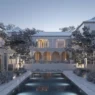 a large white house with a pool in front of it