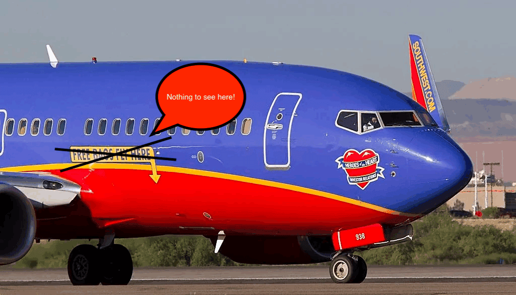 a blue and red airplane on a runway
