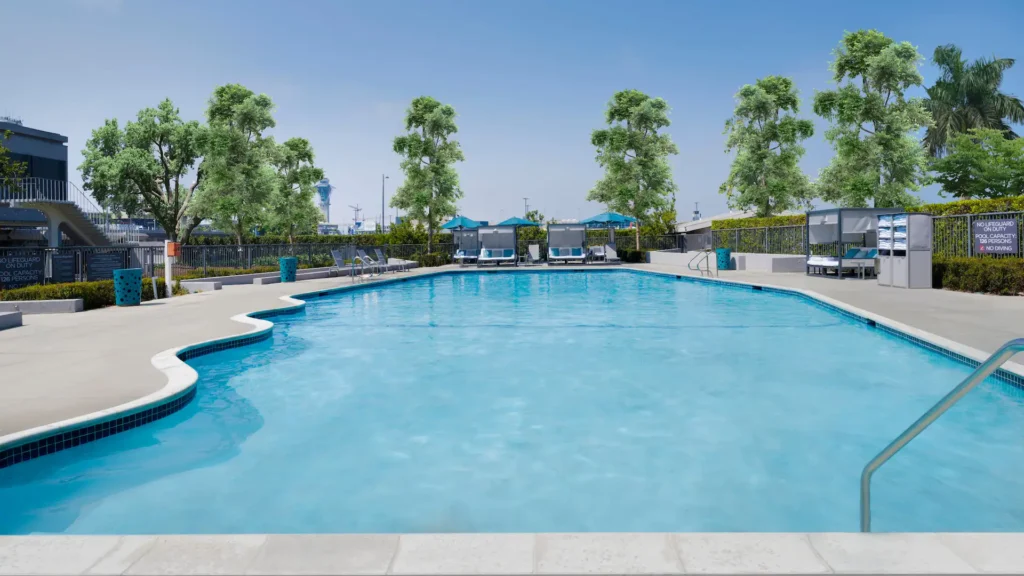 a pool with chairs and trees