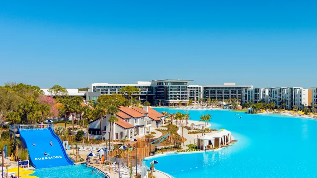 a water park with a slide and a swimming pool