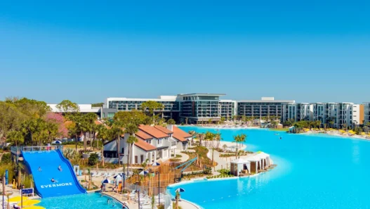 a water park with a slide and a swimming pool