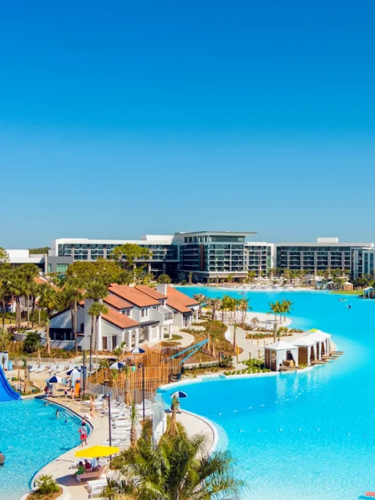 a water park with a slide and a swimming pool