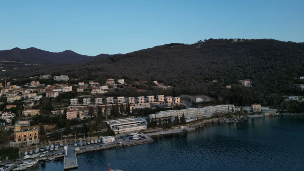 a body of water with buildings and trees