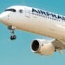 a white airplane with blue writing