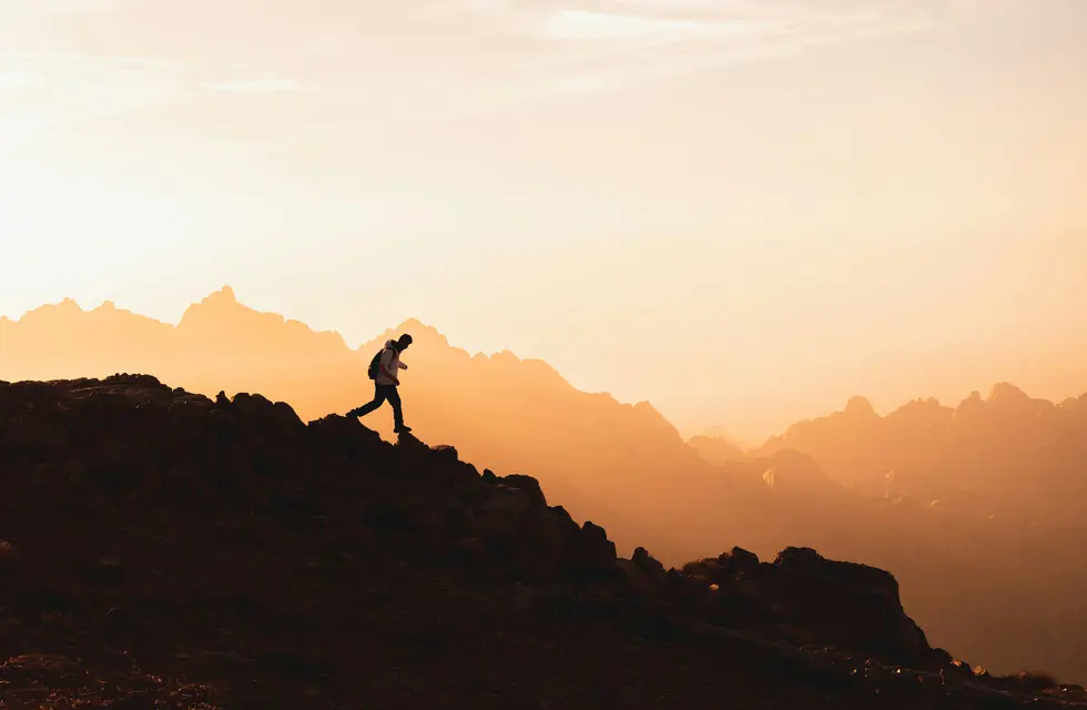 a person walking up a mountain
