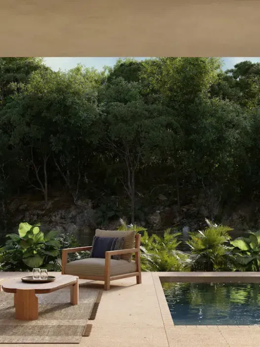 a pool and chairs on a patio