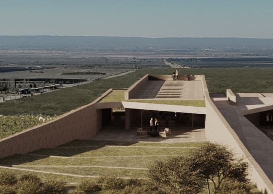 a building with a roof and a roof over a grassy field