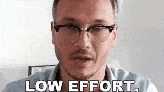 a man wearing glasses and a blue shirt
