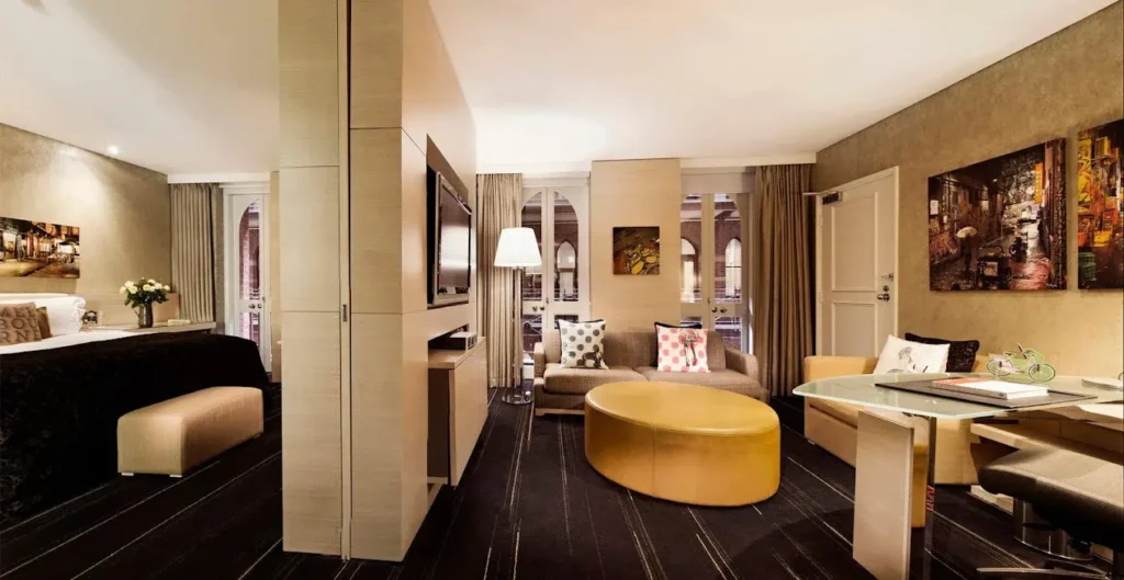a room with a round table and a television