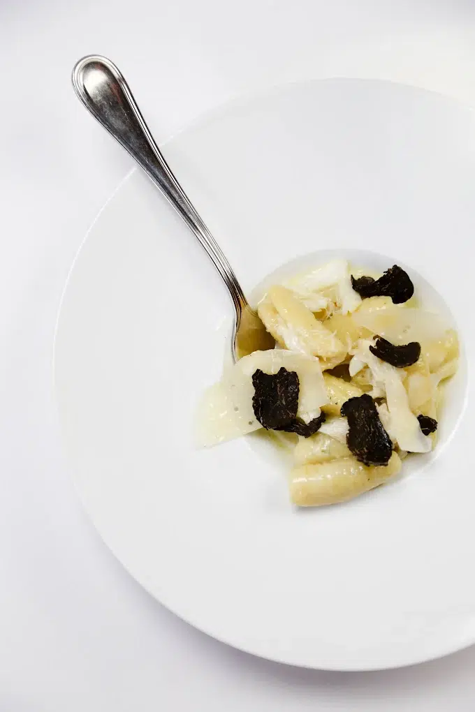 a plate of food with a spoon