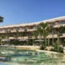 a building with palm trees and a pool
