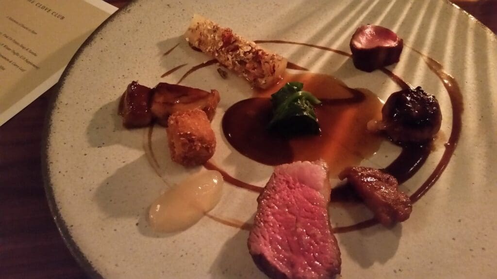 a plate of food on a white surface