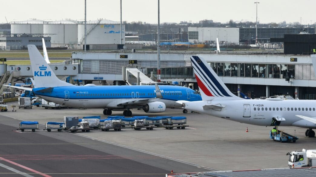 a group of airplanes at an airport