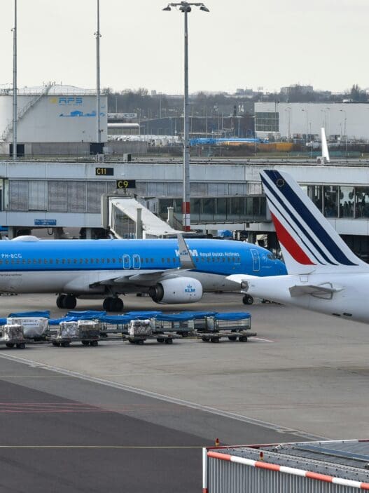 a group of airplanes at an airport