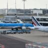a group of airplanes at an airport
