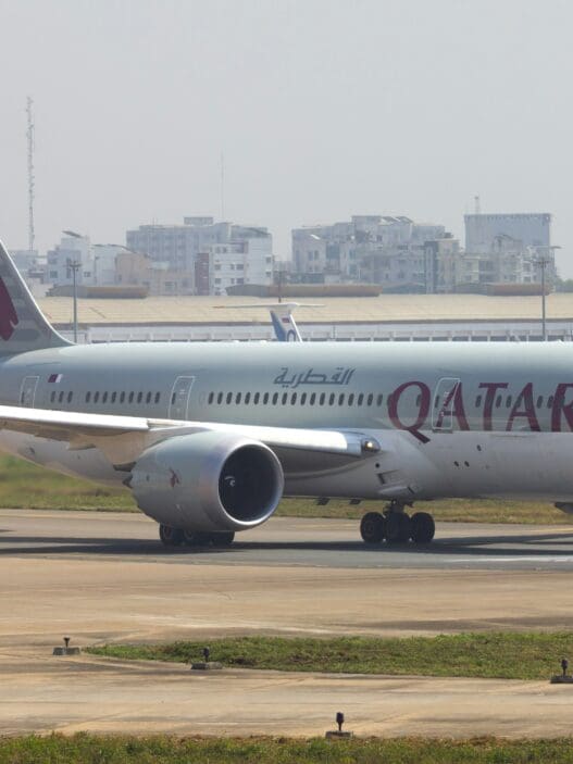 a large white airplane on a runway