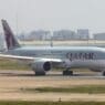 a large white airplane on a runway