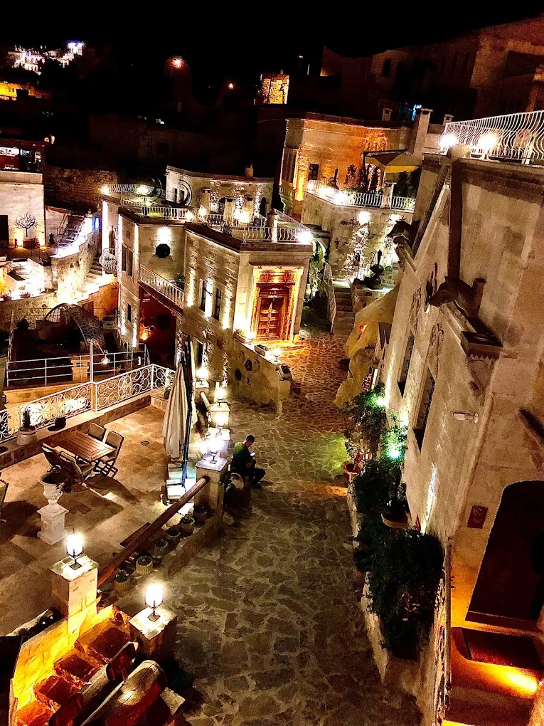 a courtyard with lights on