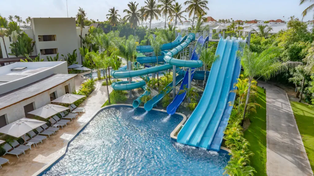 a water park with a pool and a slide