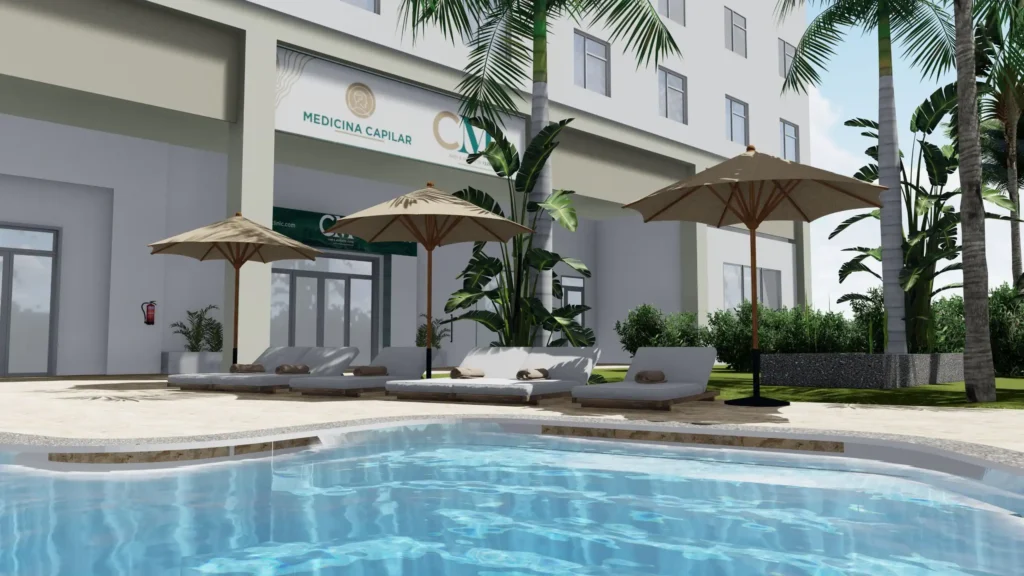 a pool with umbrellas and lounge chairs in front of a building