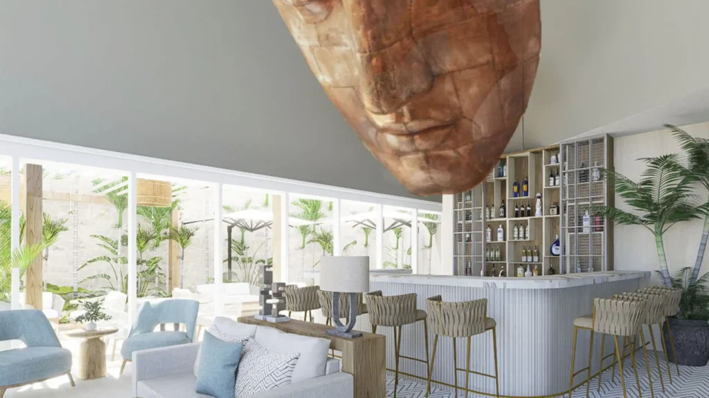 a bar with a large face from the ceiling