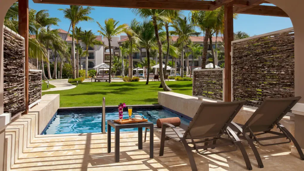 a pool with a lounge chair and a tray on it
