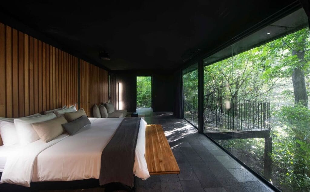 a room with a bed and a bench