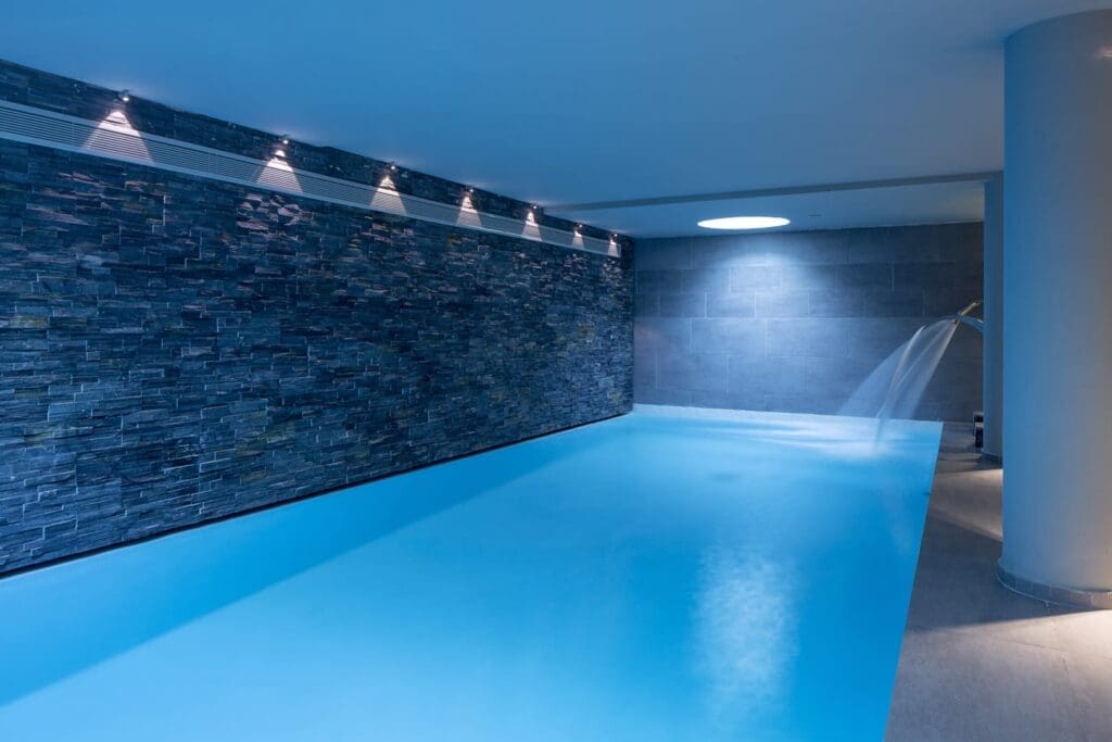 a pool with a waterfall