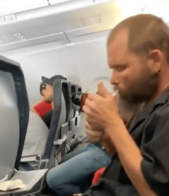 a man sitting in an airplane
