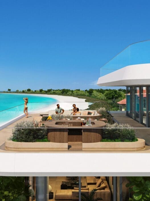 a group of people on a balcony overlooking a beach