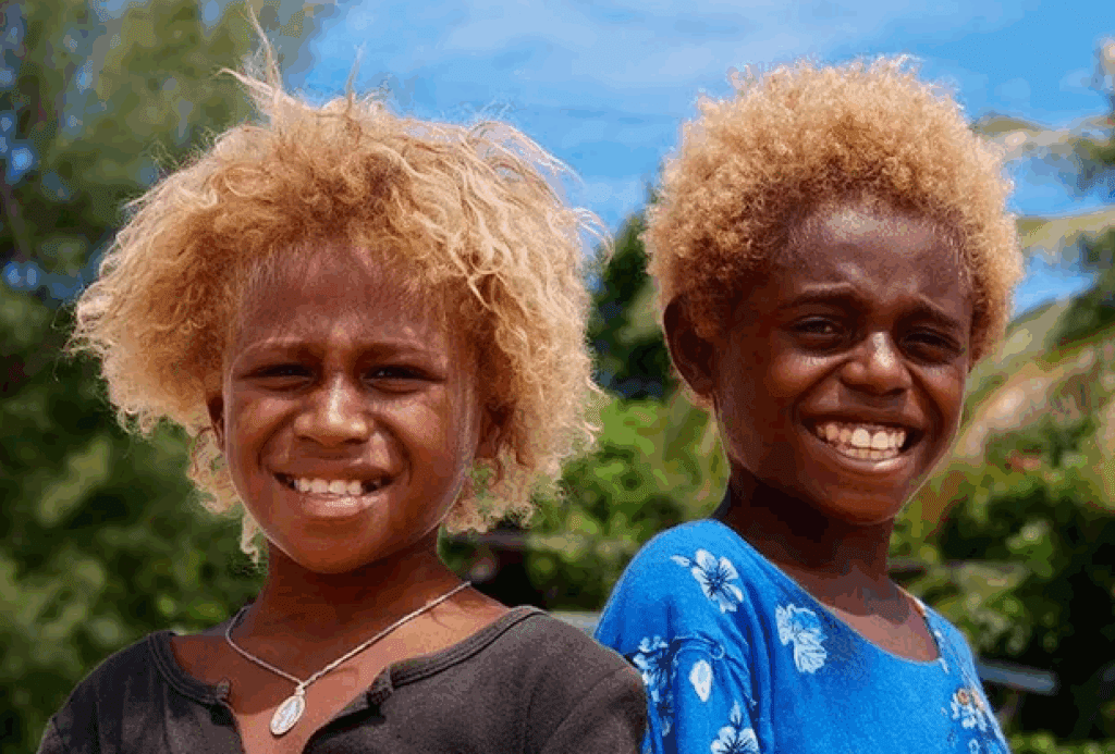 two children smiling for the camera