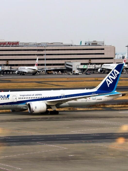 a group of airplanes on a runway