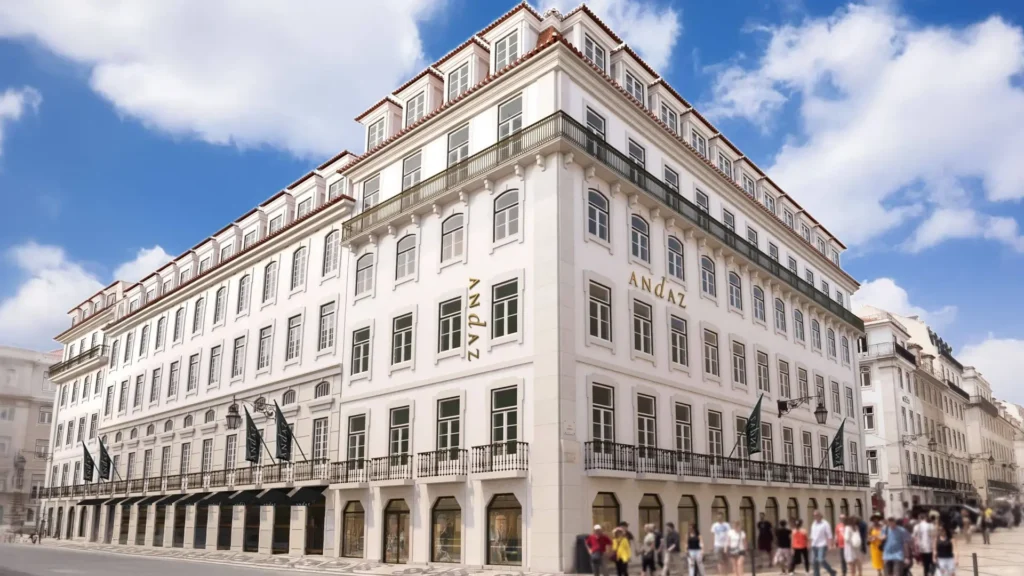 a white building with people walking around