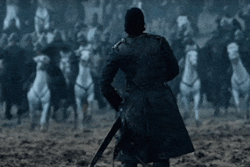 a man in a black coat holding a sword