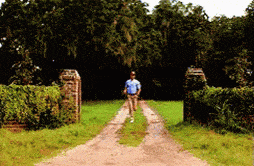 a man running on a dirt road